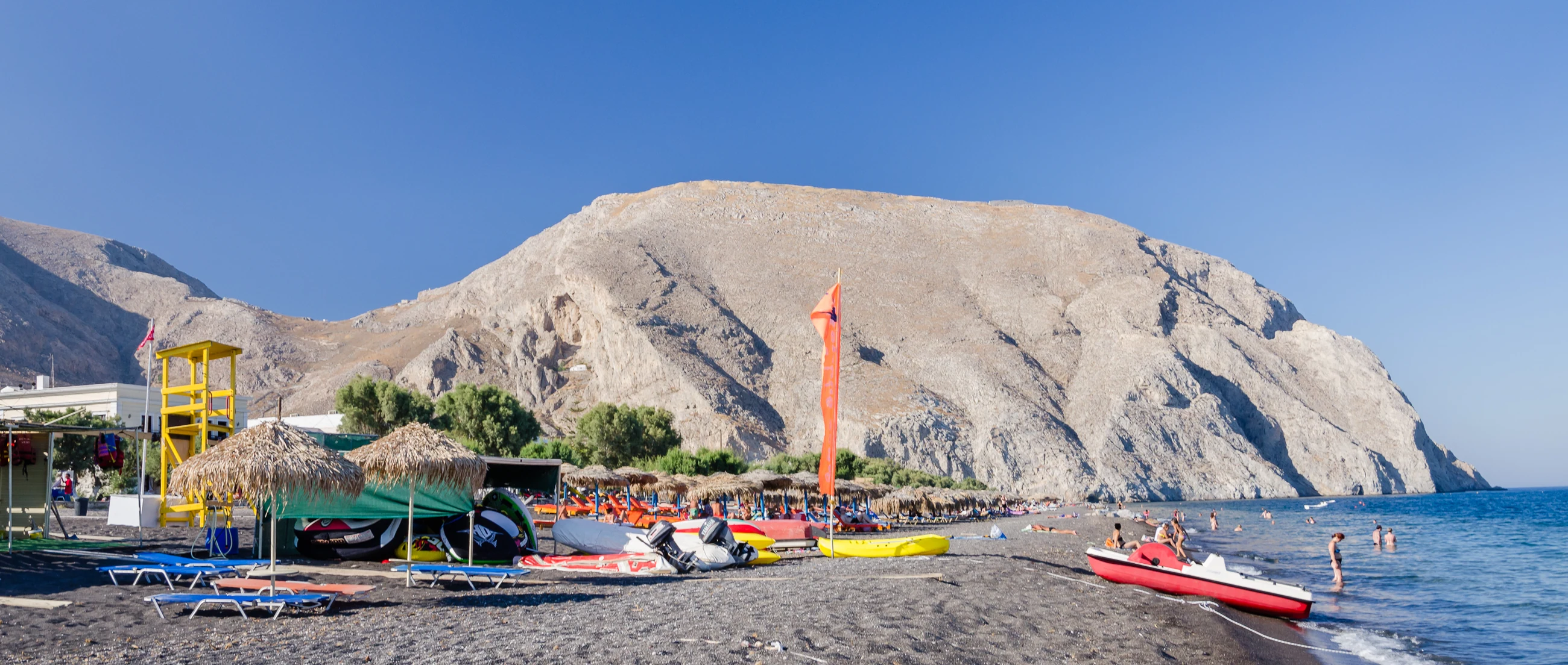 Perissa black-sand beach, Mesa Vouno and the Aegean Sea